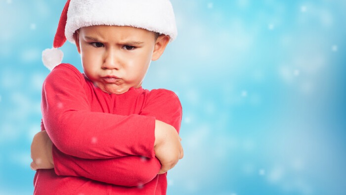 © asierromero, stock.adobe.com portrait of a little boy on christmas time with angry gesture